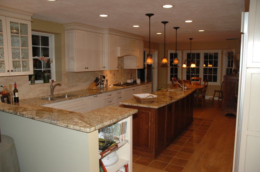 Finished kitchen with a granite island and pendant lighting